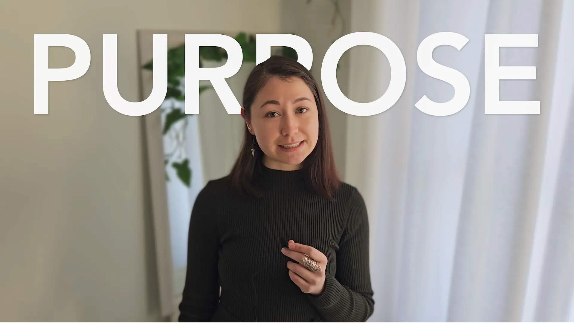 YouTube thumbnail of Michél Lipan speaking on camera, with bold overlay text “Purpose”.